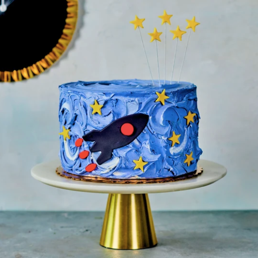 Rocket cake with fondant rocket and fondant star topper
