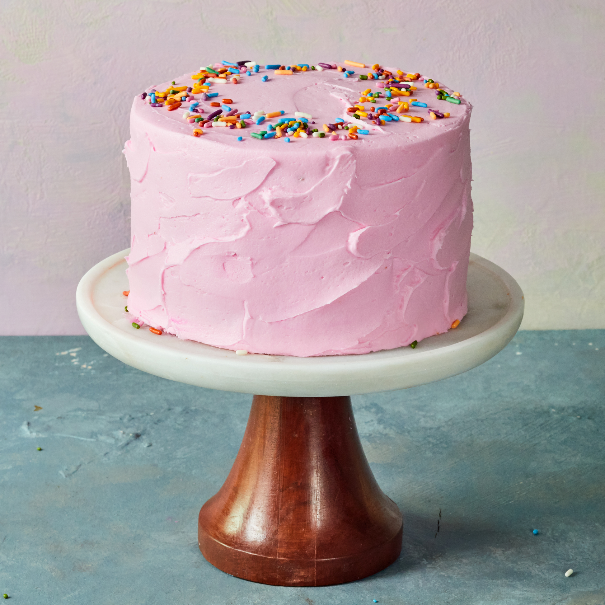 Pink birthday cake with sprinkles